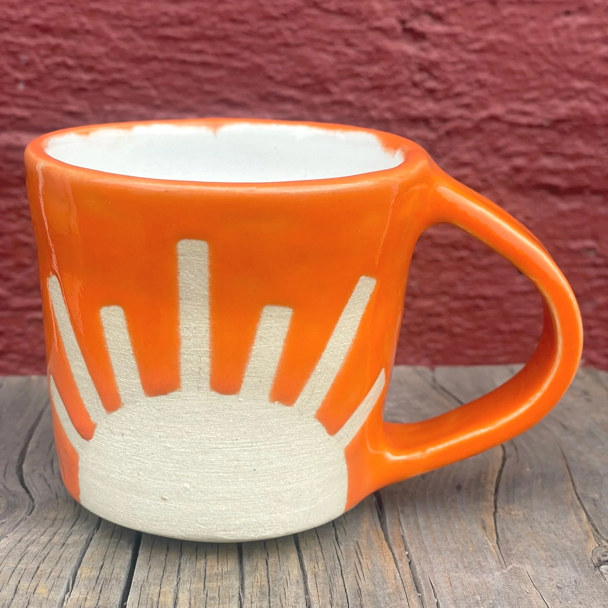 Bright colored sunshine mug in white clay
