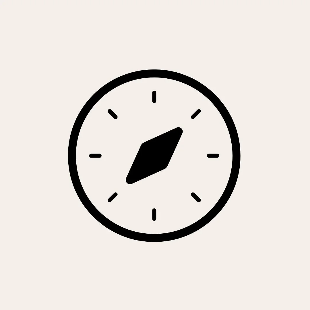 Minimalist black clock with hands showing 10:20 on a light background.