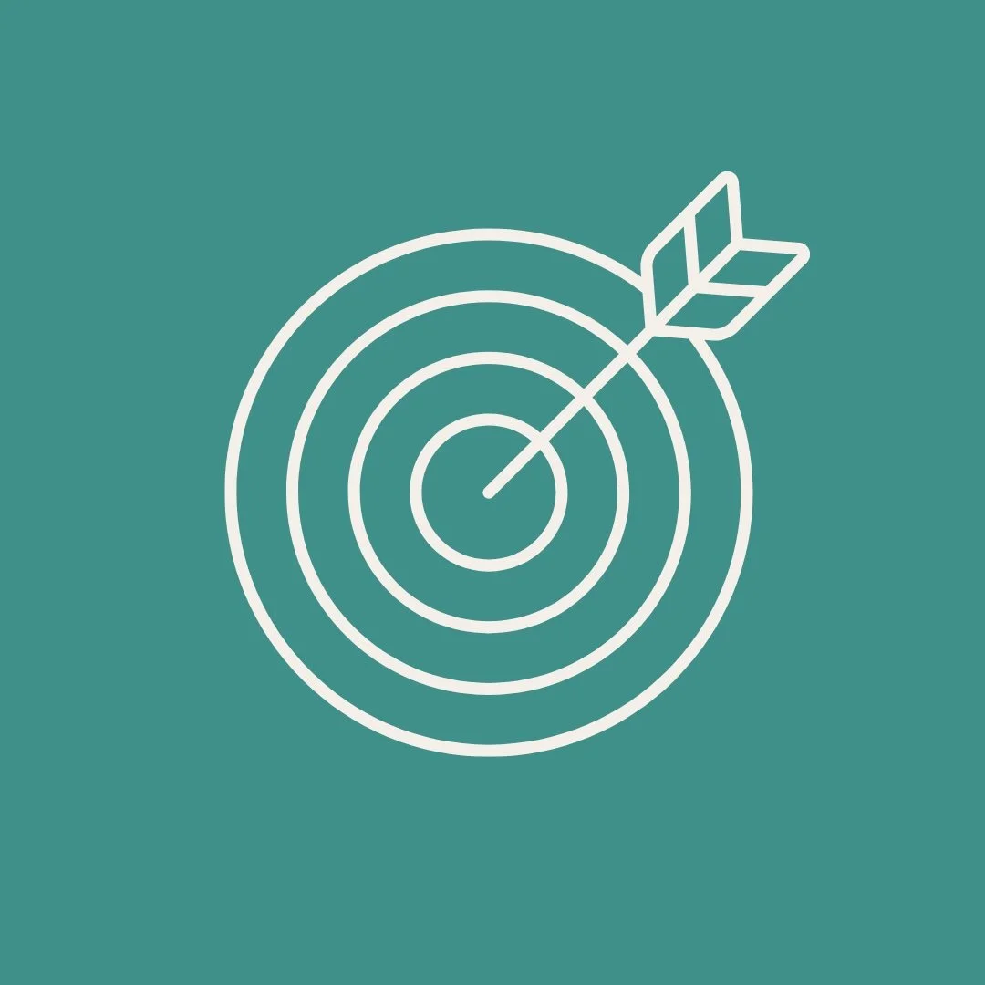 A graphic of a target with concentric circles and an arrow hitting the bullseye.