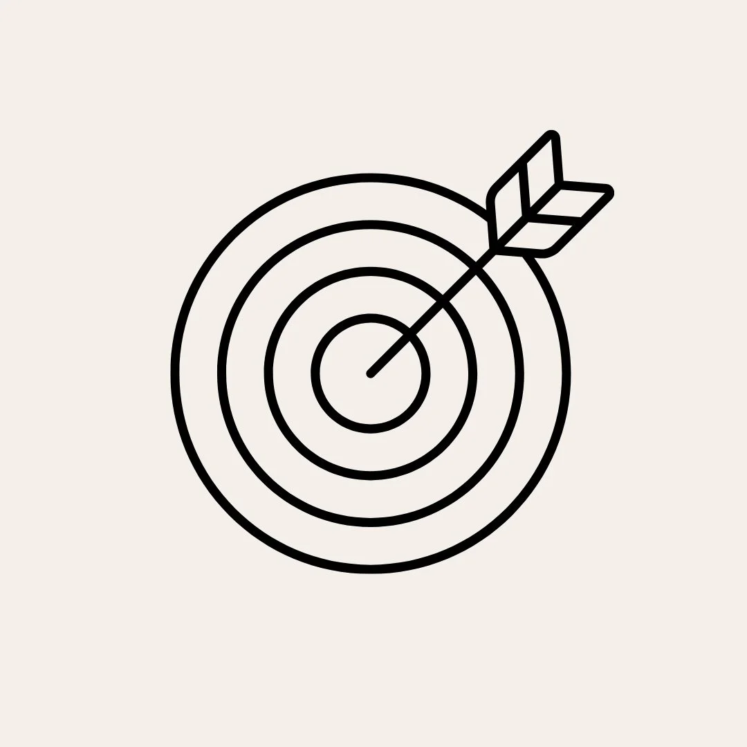 Simplified black and white illustration of a target with an arrow hitting the bullseye.