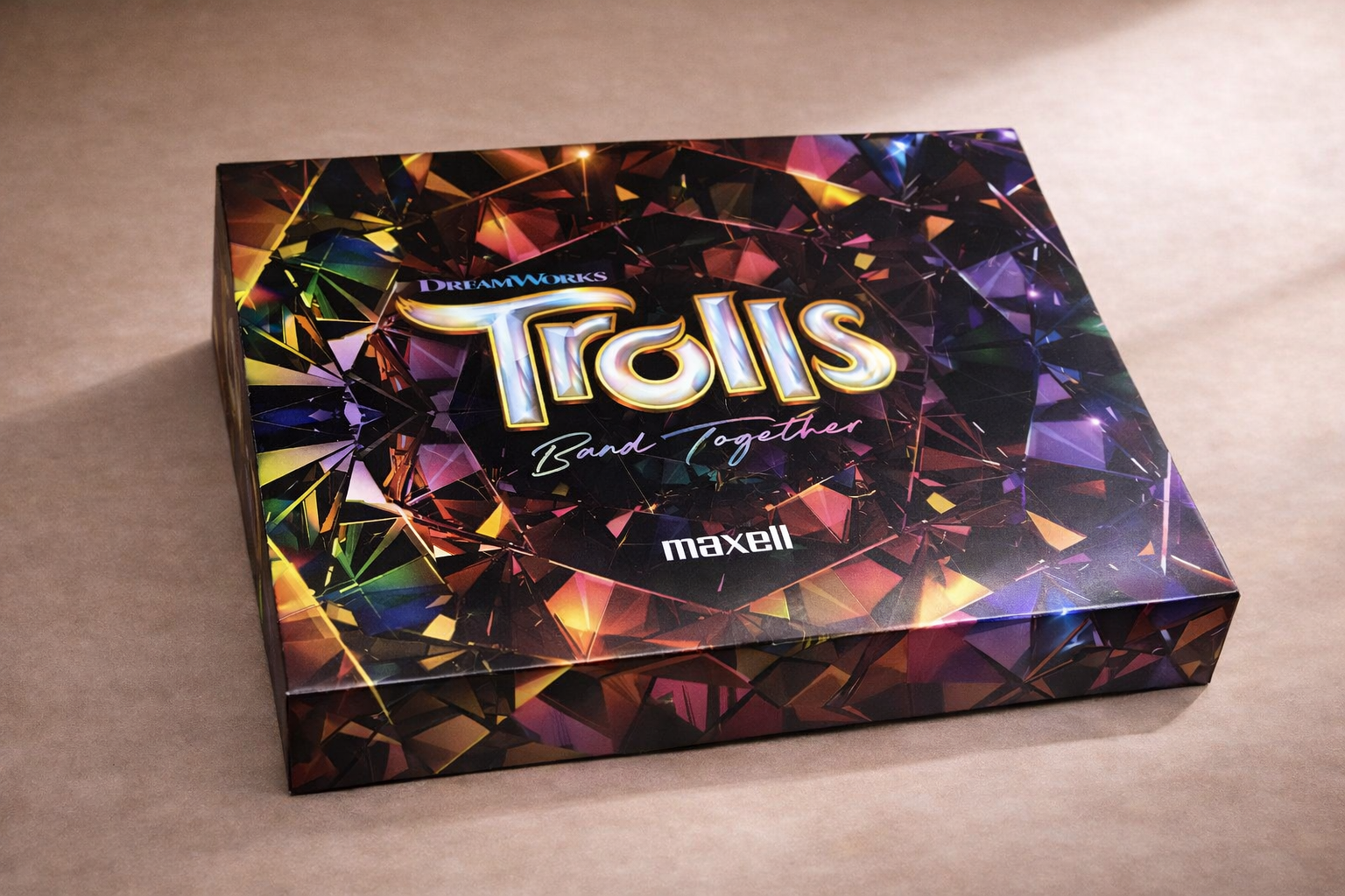 A colorful, holographic box for the game 'Talis: Band Together' by Maxell, featuring the title and vibrant, geometric patterns.
