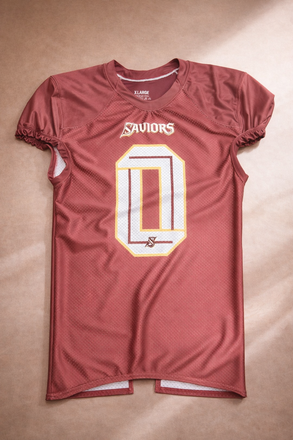 A maroon football jersey with the number zero and the word "Saviours" printed on the front.