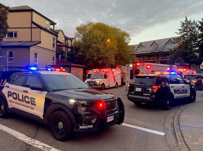 Emergency scene showing New Westminster Police Department and BC Ambulance Service