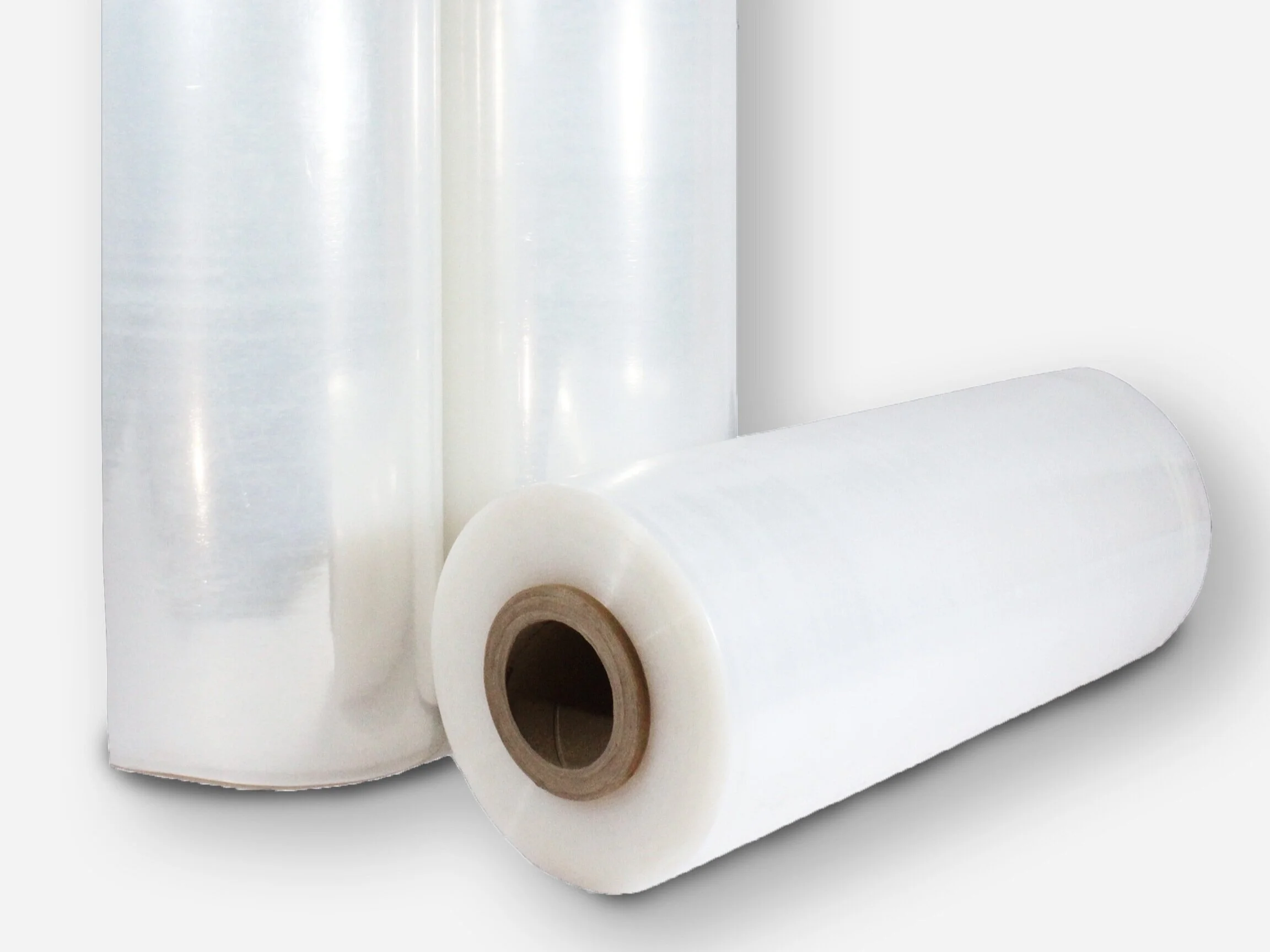 Two large rolls ofheat shrink wrap film to be used for packaging or wrapping.