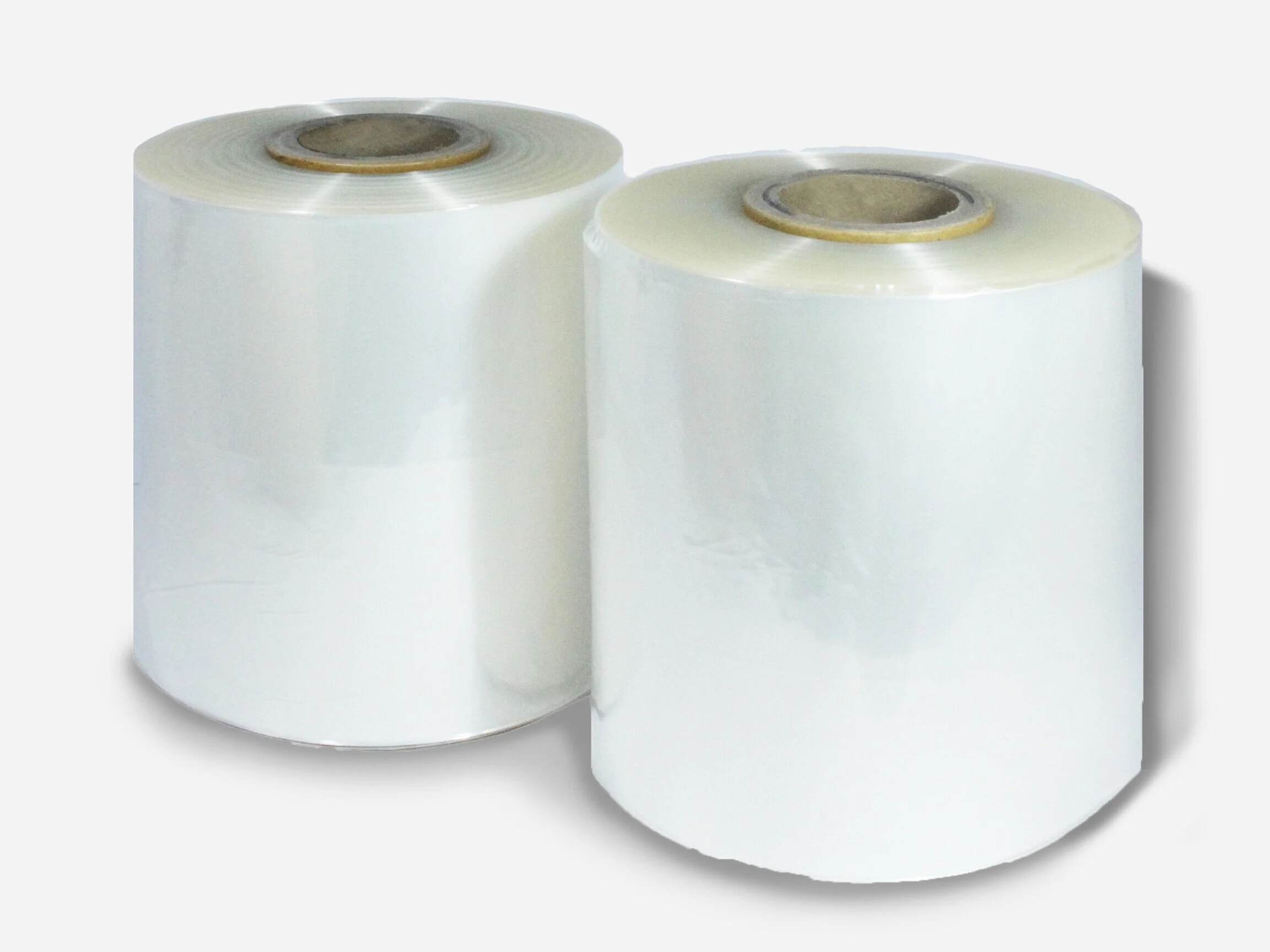 Two large rolls of white plastic or stretch film.