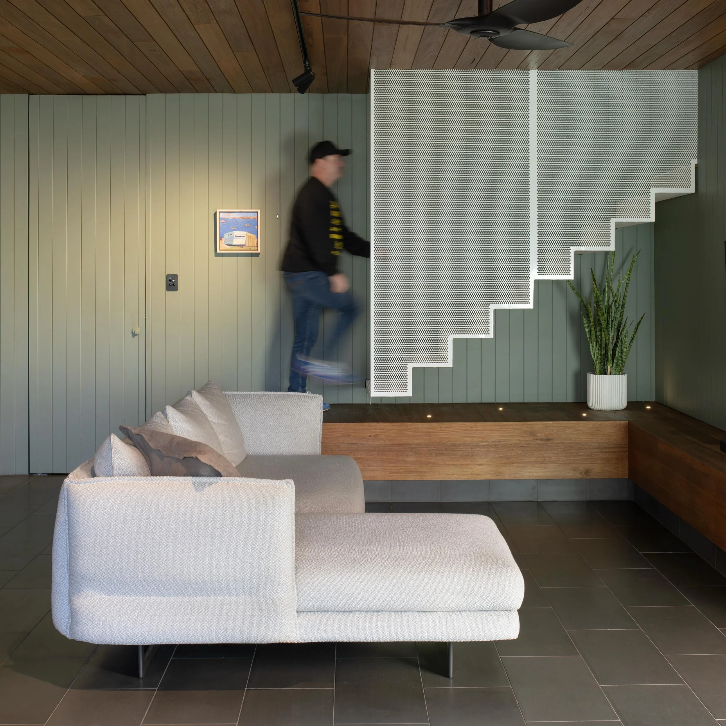 Folding one material.

Our Cornerstone project plays with folding perforated metal into different functions &amp; experiences.
Internally, perforated metal is folded into a stair, connecting the original character home above &amp; the modern undercro