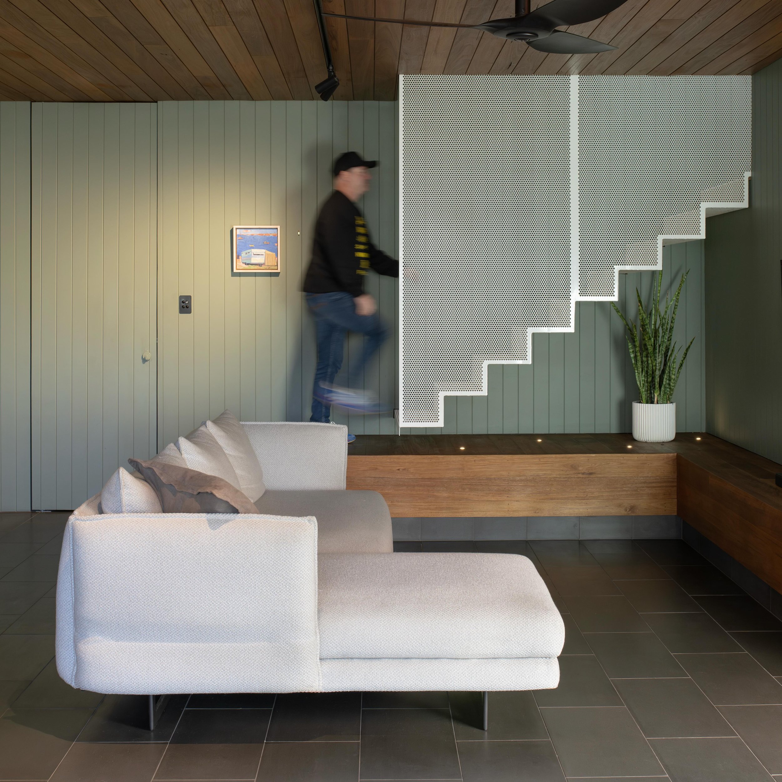 Folding one material.

Our Cornerstone project plays with folding perforated metal into different functions &amp; experiences.
Internally, perforated metal is folded into a stair, connecting the original character home above &amp; the modern undercro