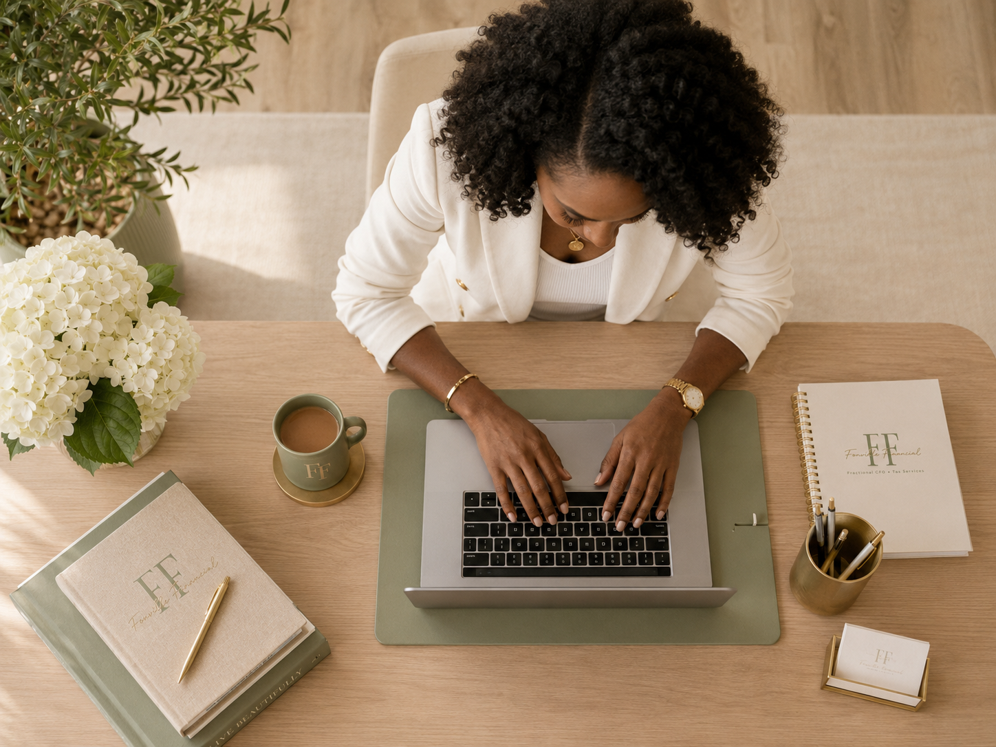 Sabrina M. Fonville working on financial strategy at her desk, fractional CFO services in Falls Church, VA