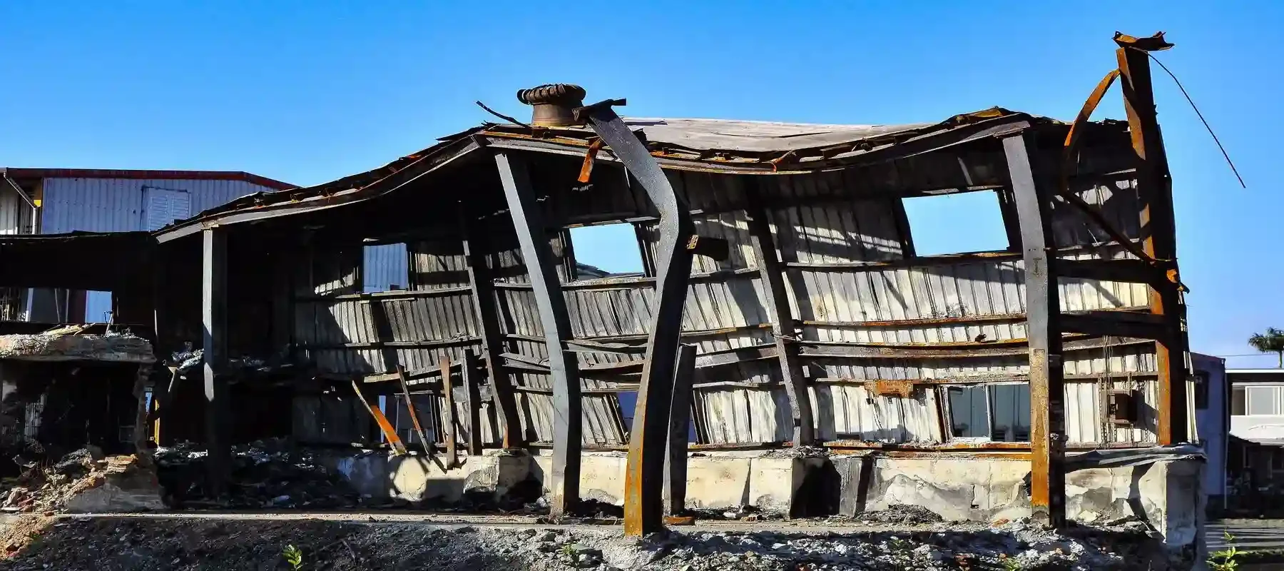 Conceptual image of a fragile business structure kept upright by financial support, representing the risks of debt-dependent business models.