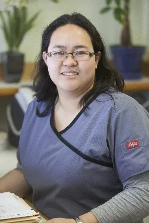 Friendly dental team member at Dr. Kao Pediatric Dentistry, smiling in the Daly City office