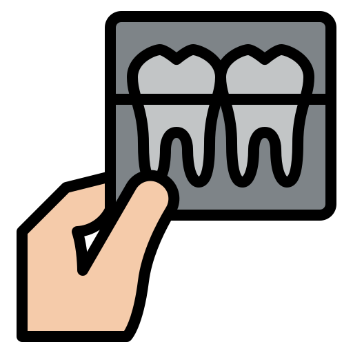 Hand holding a dental X-ray showing two teeth with roots.