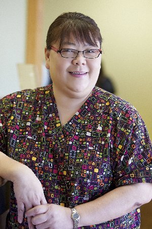 Pediatric dental assistant in colorful scrubs at Dr. Kao's Daly City children's dentist office