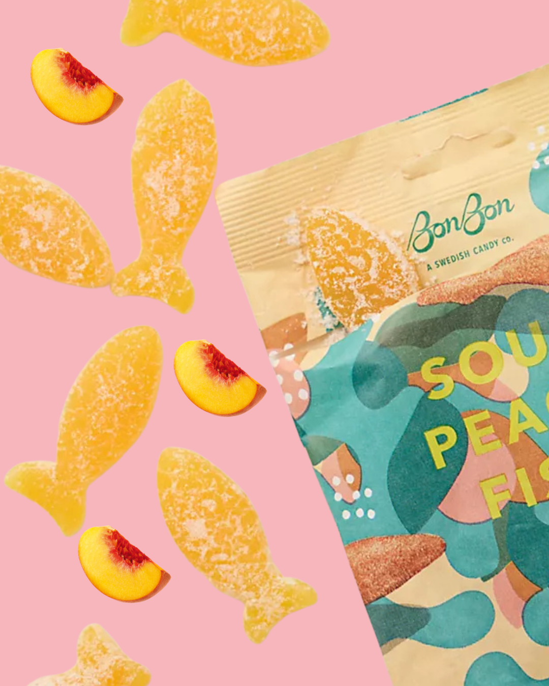 Pink background with peach slices and gummy peach candies scattered on the left side. Partially visible colorful packaging of BonBon sour peach candies on the right side.
