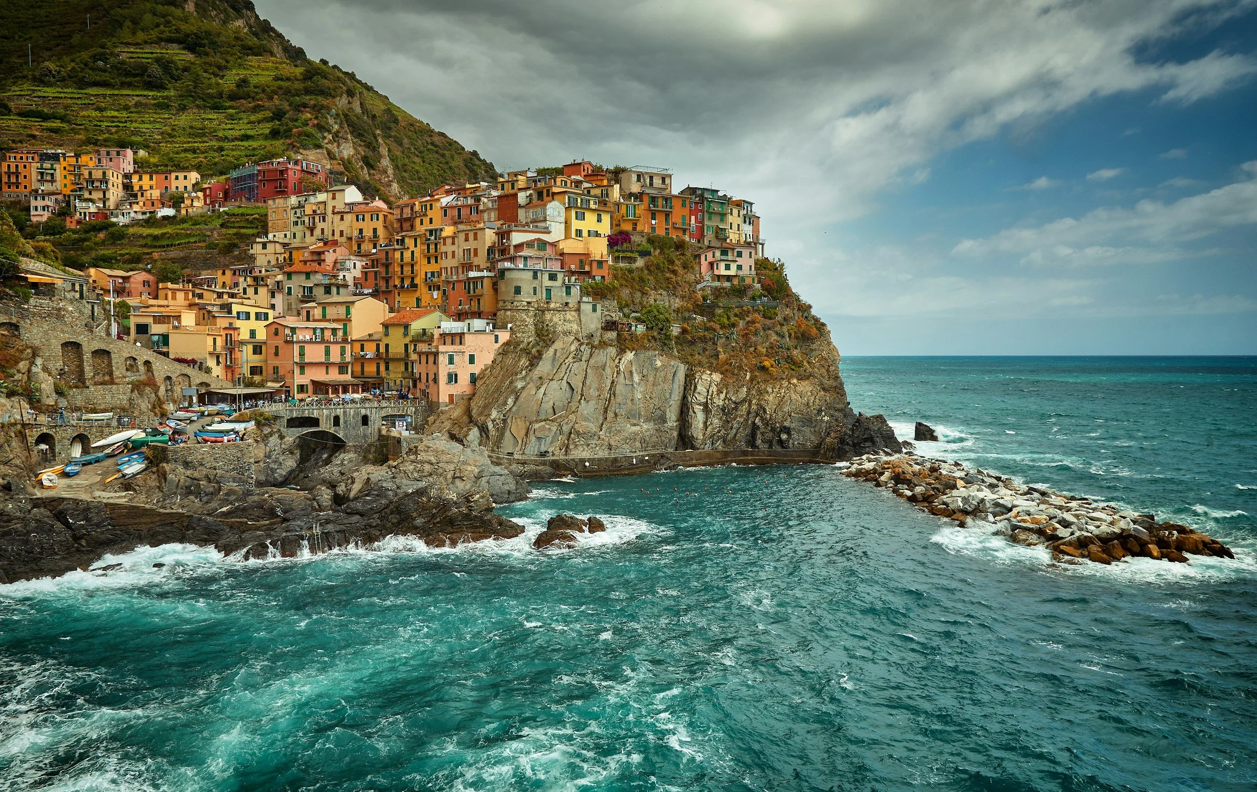 Colorful houses, built on a cliffside overlooking the sea, in the coastal village of Cinque Terre, Italy.