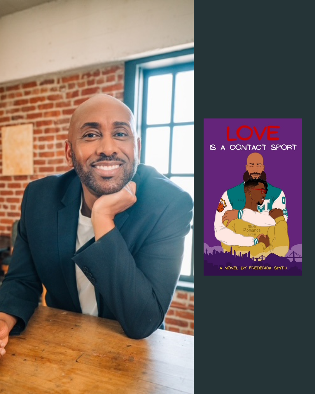 A smiling man with a bald head and beard, wearing a dark blazer and white shirt, sitting at a wooden table in front of a brick wall and window.