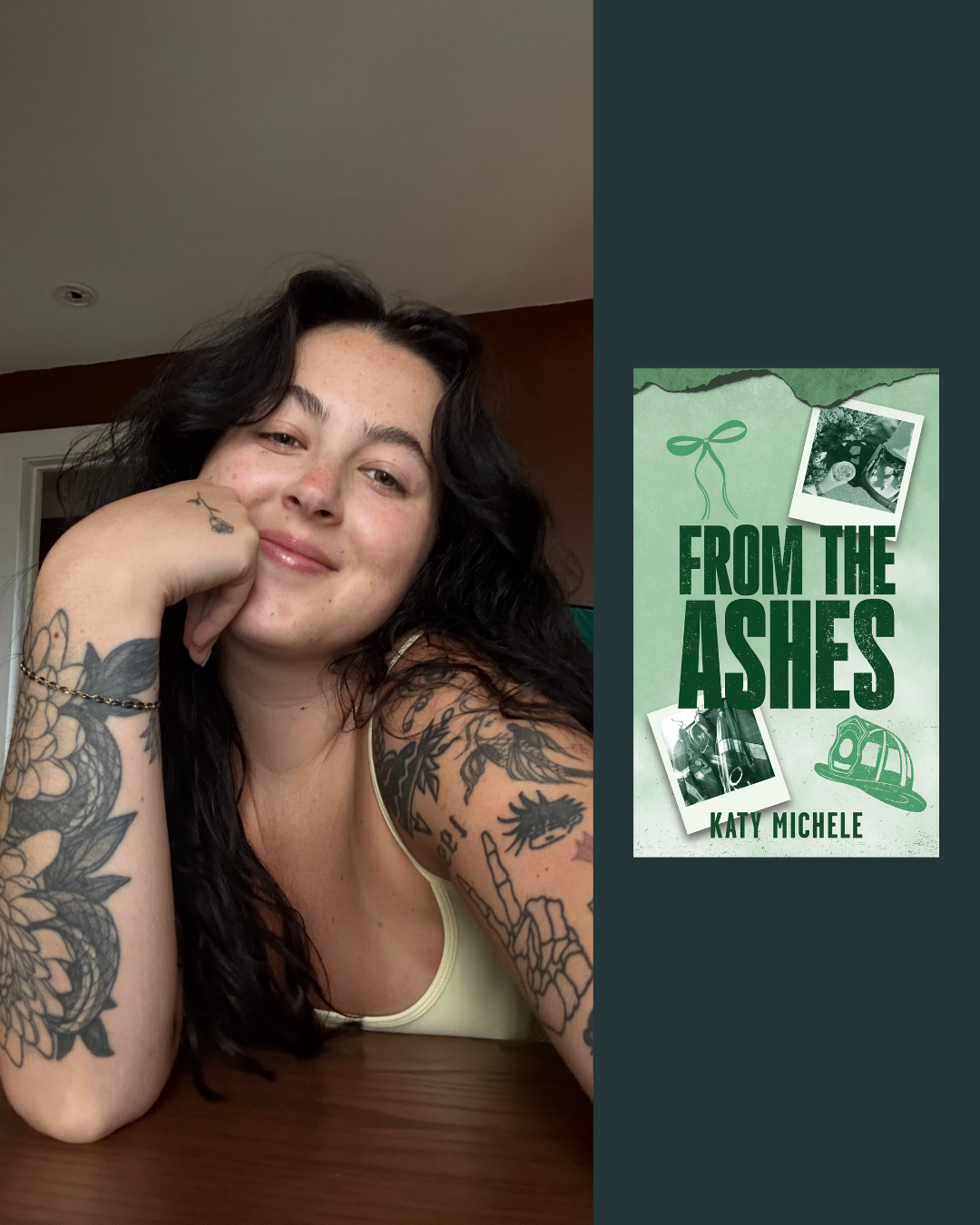 A woman with long dark wavy hair and tattoos on her left arm is smiling and resting her chin on her hand, sitting at a wooden table indoors. She is wearing a light-colored tank top.