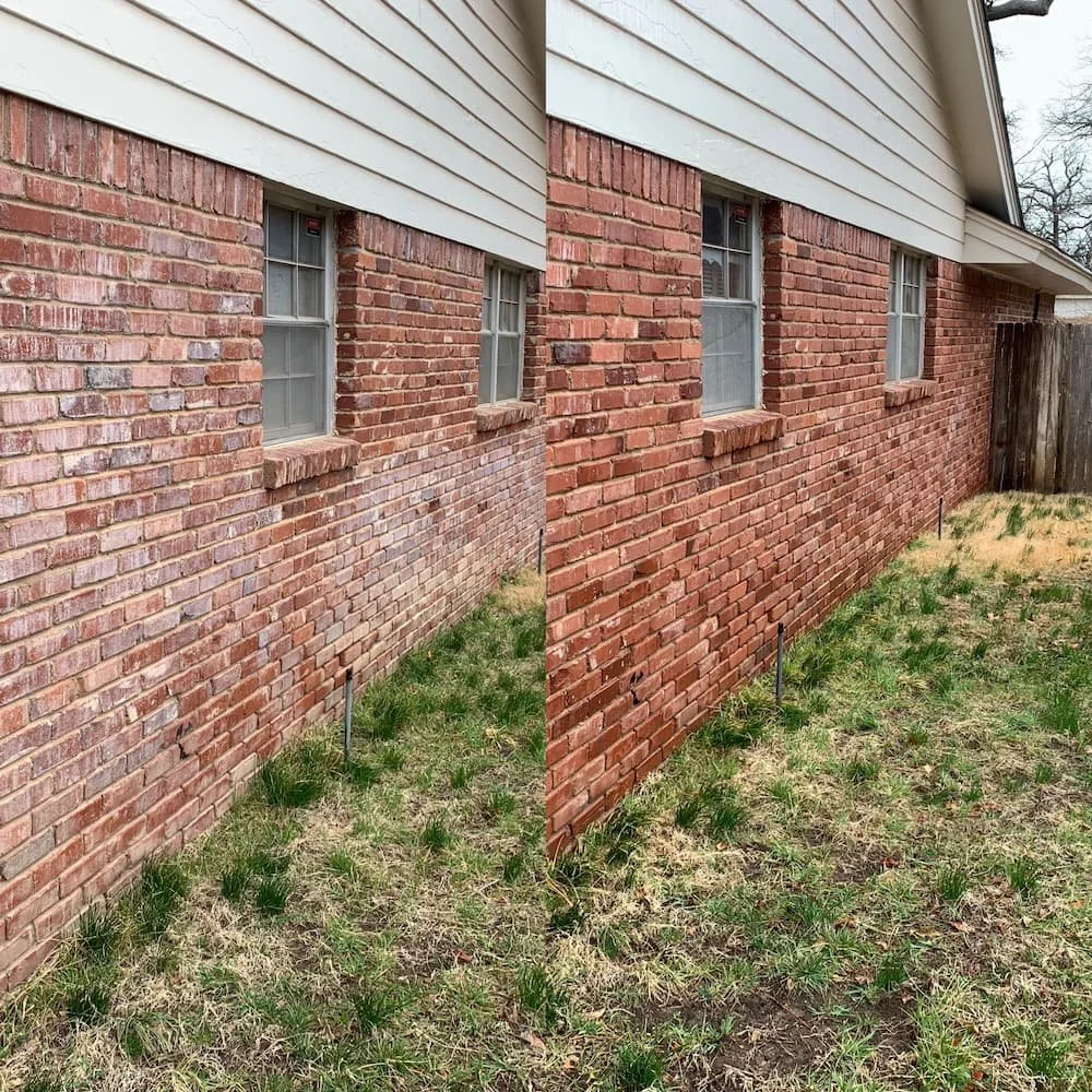 Comparison of the same brick wall before and after cleaning or repair, with small window sashes and some grass on the ground.