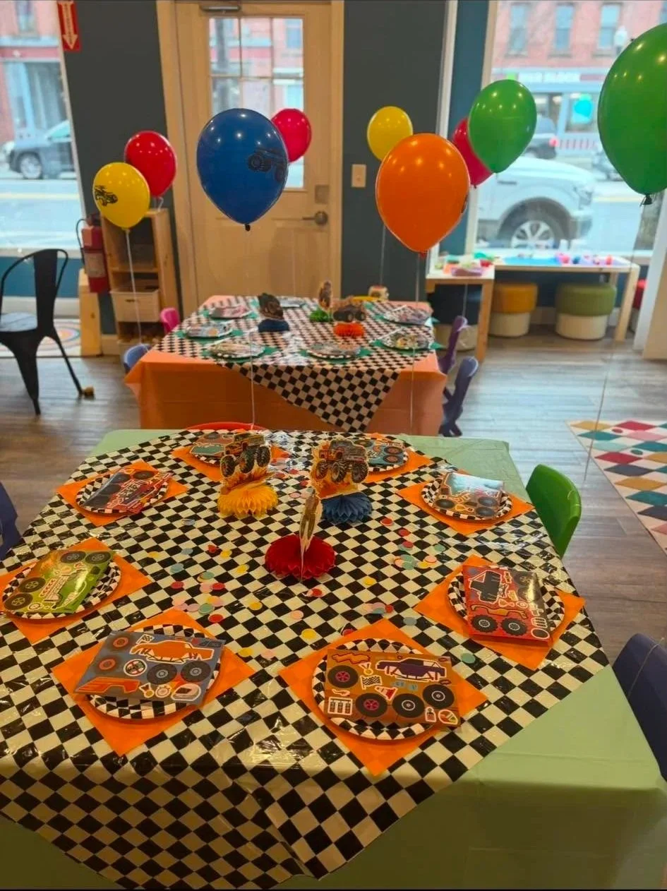 A race car themed birthday party set up at Play Date