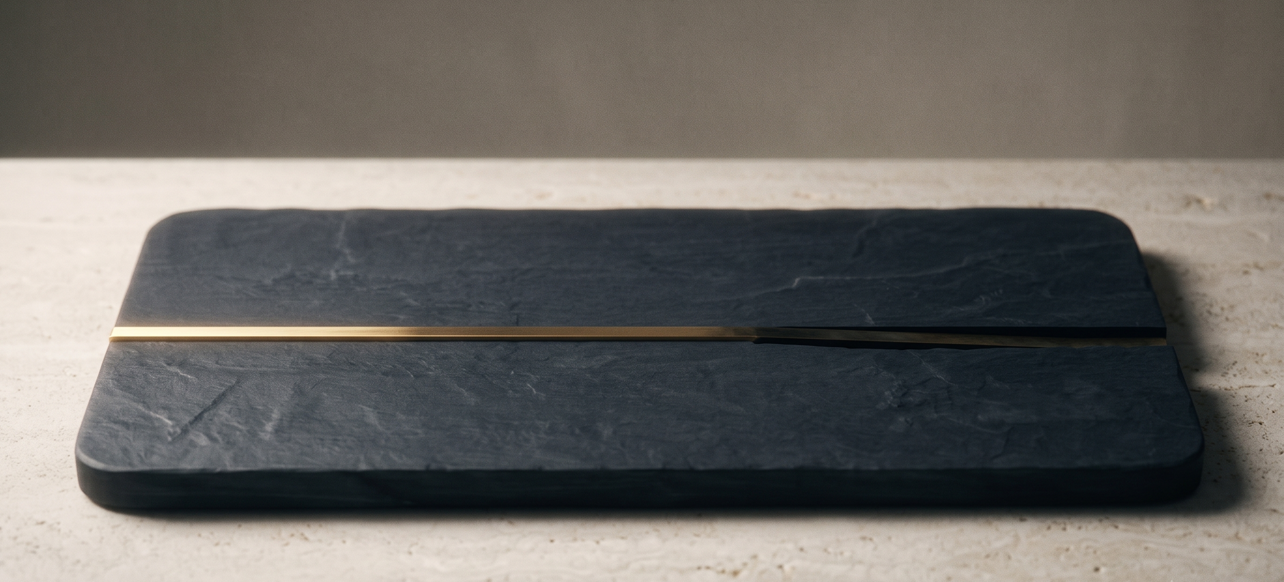 A single brass line inlaid in dark stone, bright before a threshold and darkening past it, marking a commitment's point of no return.