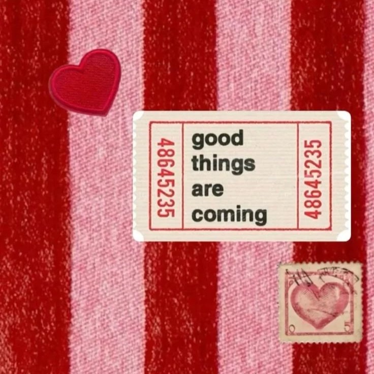 A pink and red striped fabric background with a small red heart patch, a ticket with the message 'good things are coming,' and a pink stamp with a heart design.