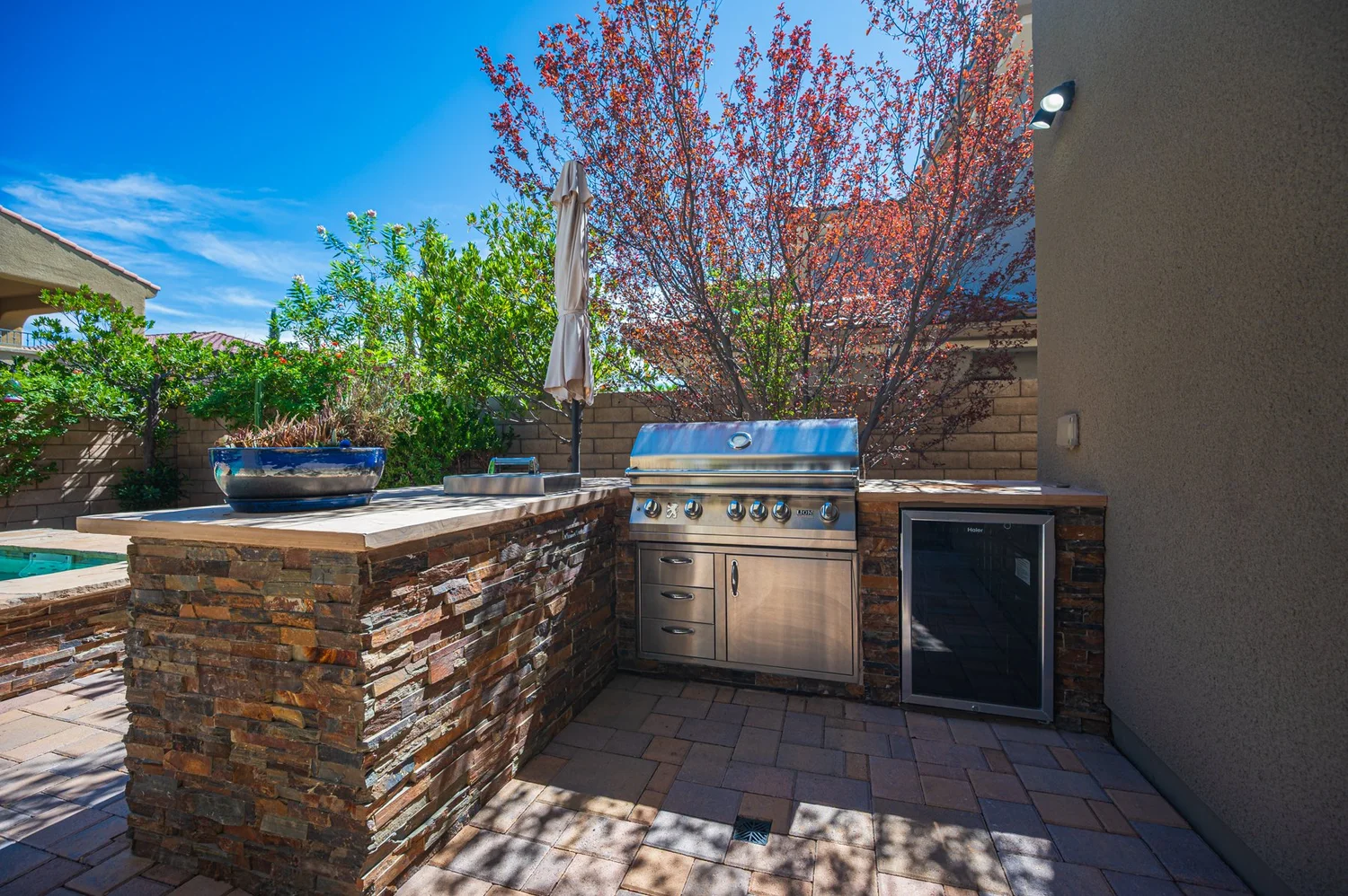 Built-in outdoor kitchen beside the pool