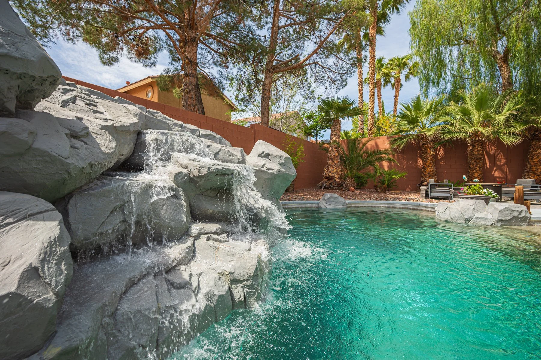 Pool waterfall in the backyard