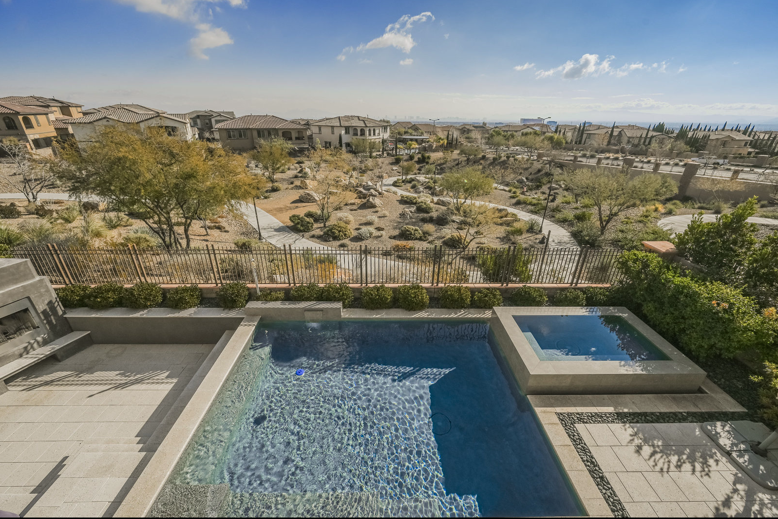 Summerlin West rear yard view with city lights trail and Red Rock Canyon