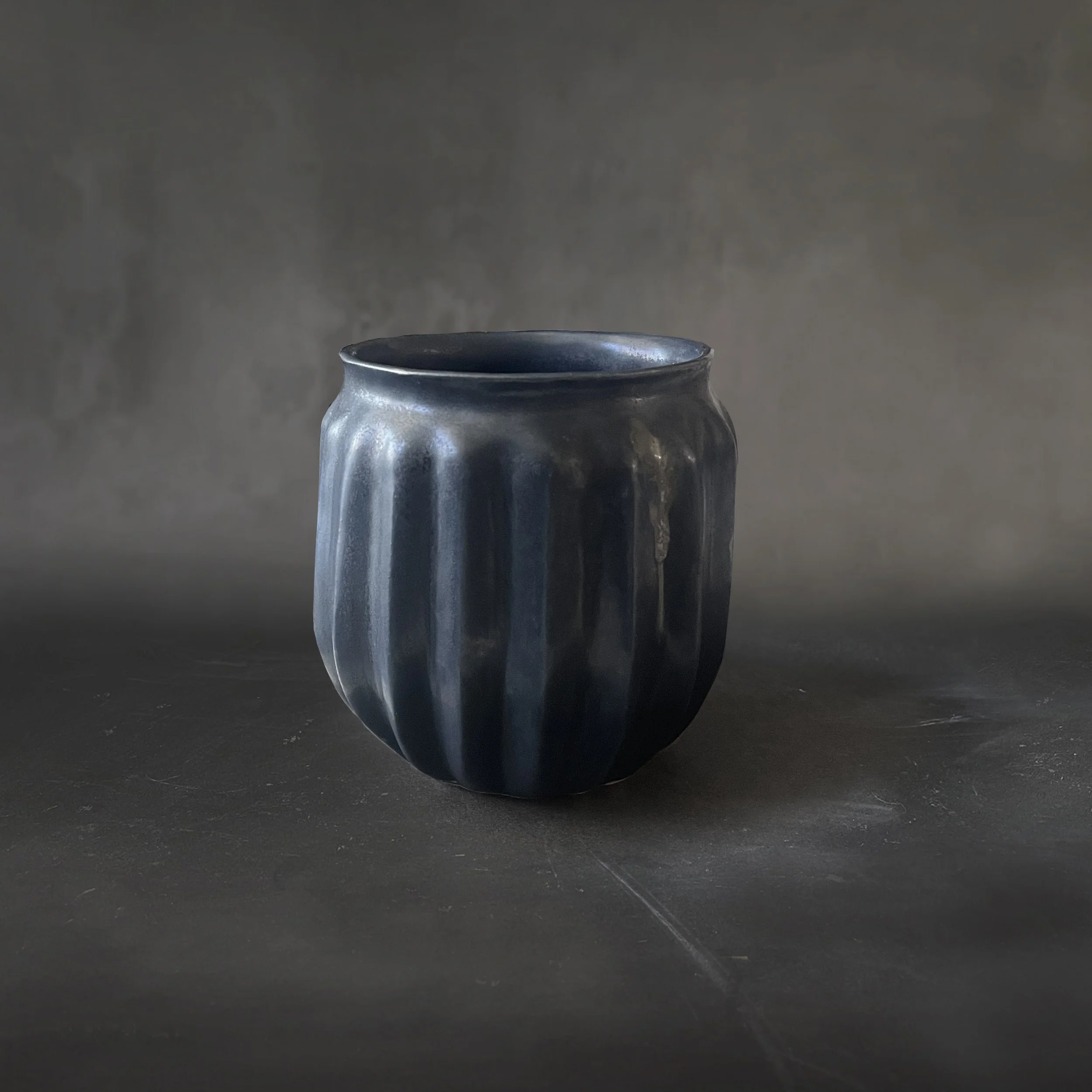 Hand-carved stoneware cup