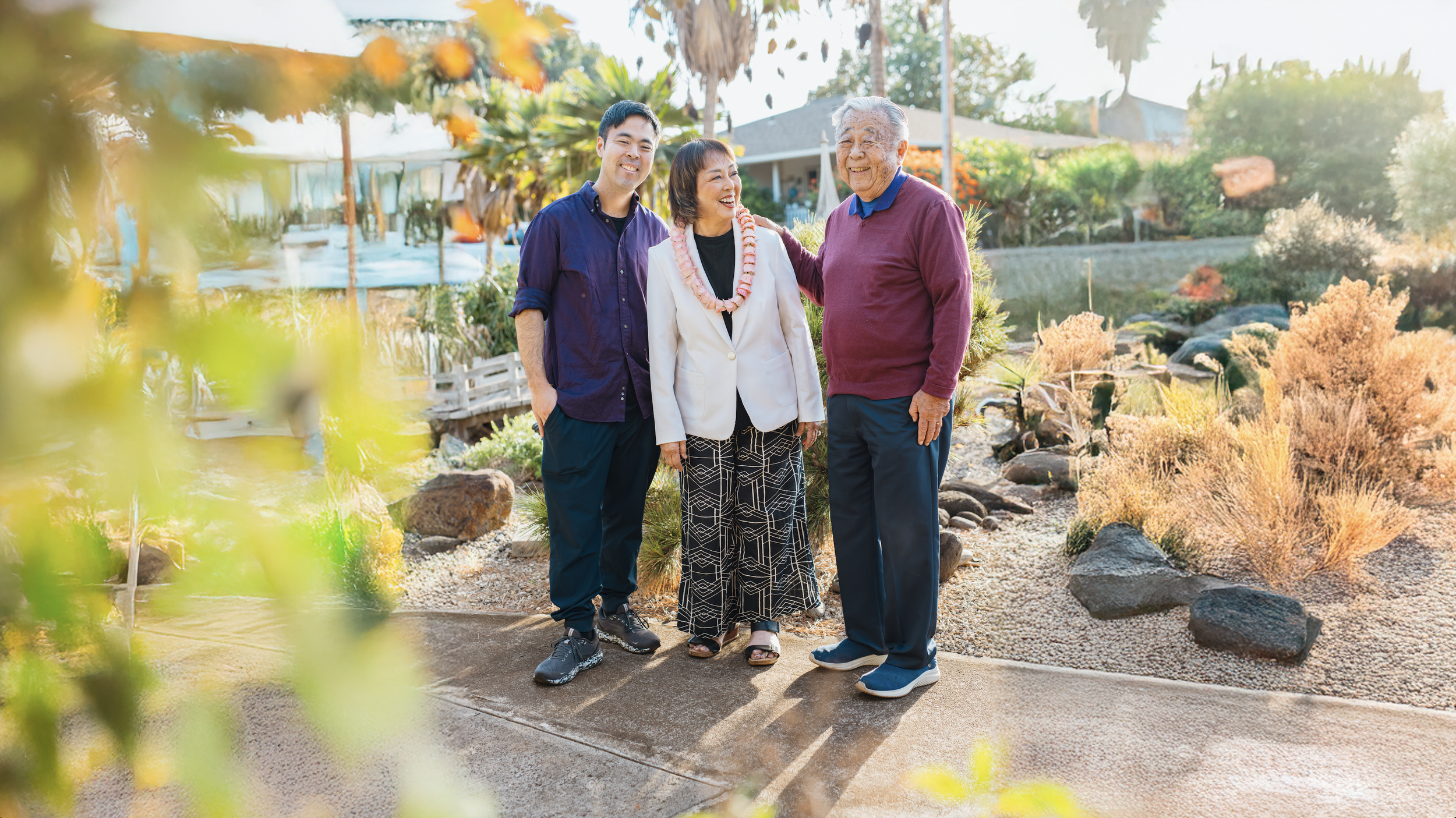 Yuki Lei with her husband Tak and Son Michael stand together for a family photo.