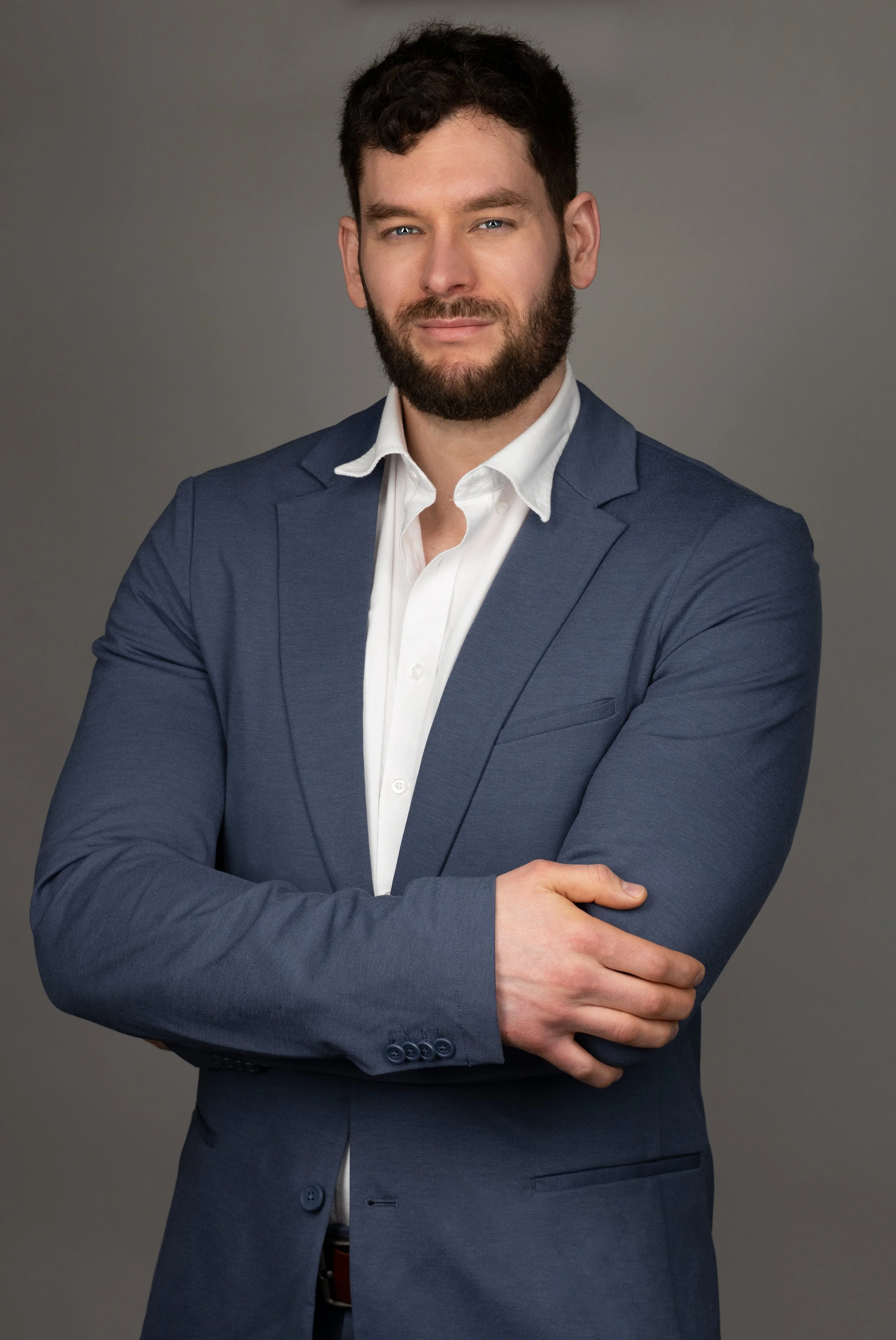 Michael Pfau, MSN, PMHNP-BC in professional attire