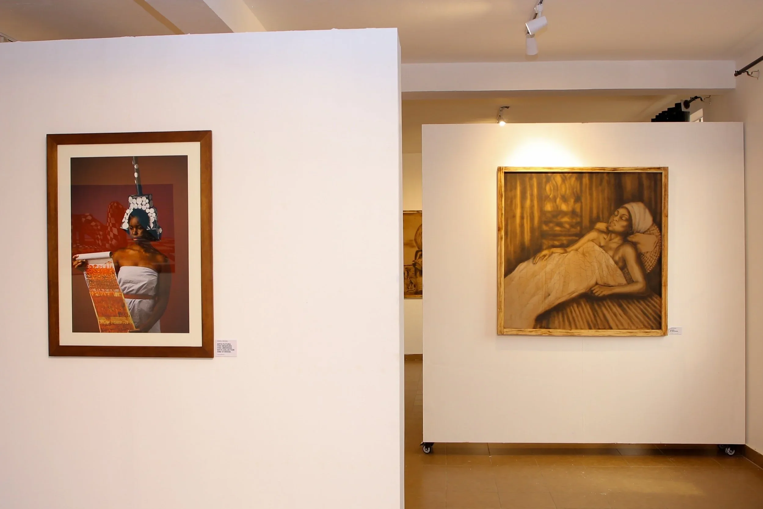 Artworks by Ugandan artists installed in a gallery