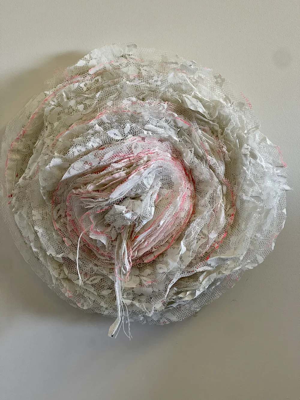 Luci Callipari-Marcuzzo, Invisible (2025), Household curtains, acrylic paint pen, thread, vintage cotton fabric, embroidery hoop, 38 x 12 cm