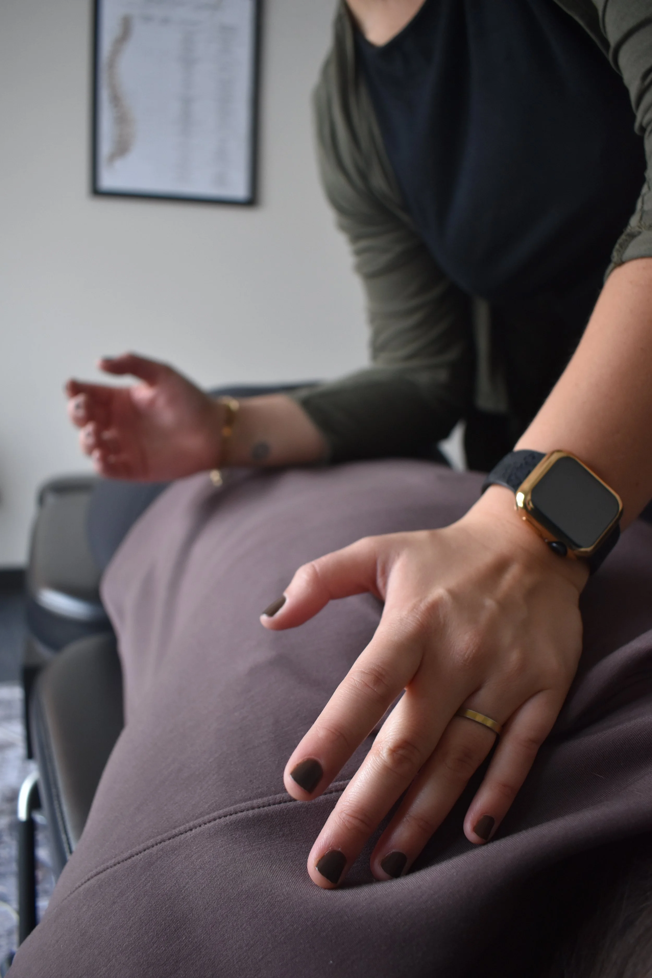 Kate Knaus performing a chiropractic adjustment on a patient