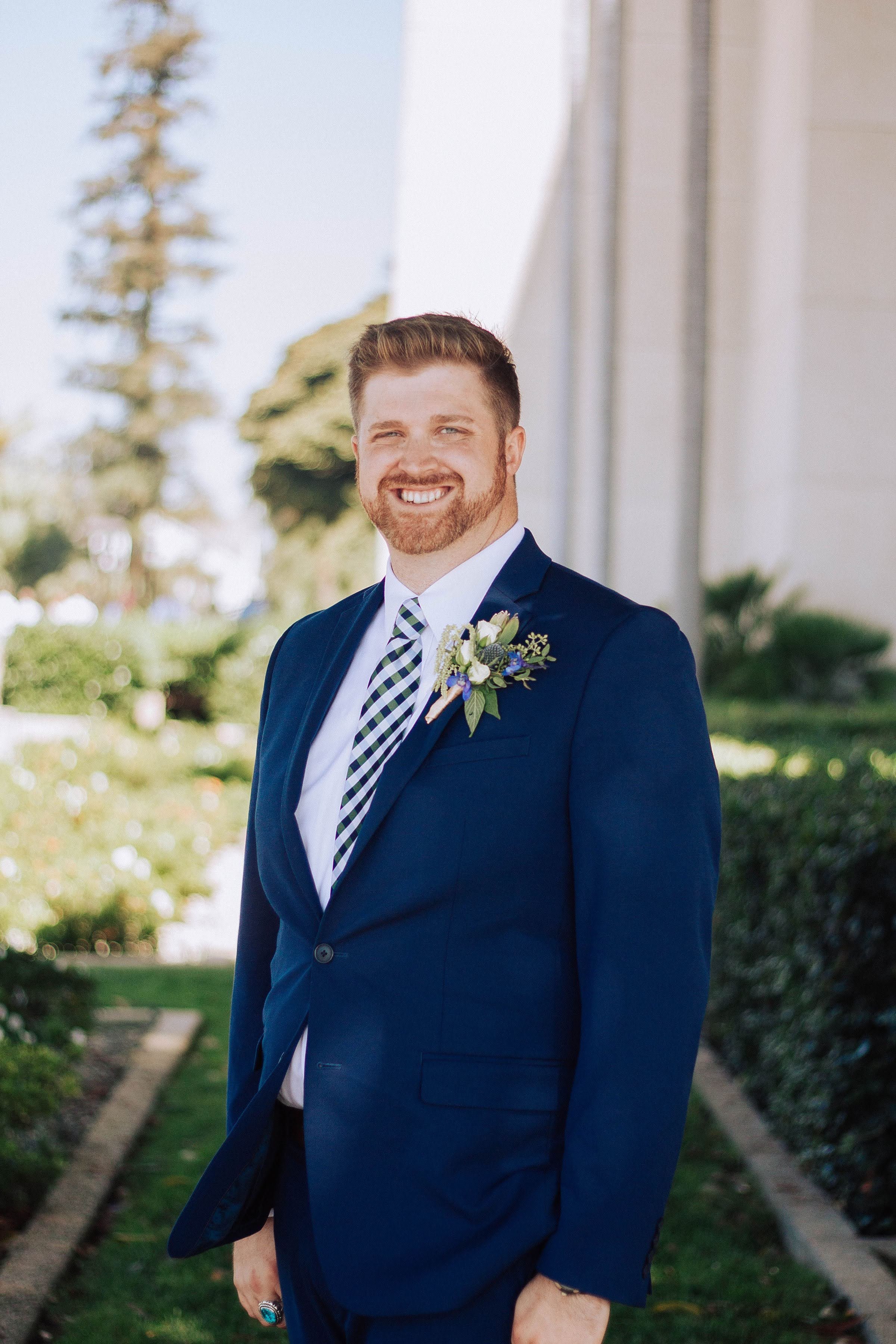 blue and green wedding flowers; blue and green boutonniere