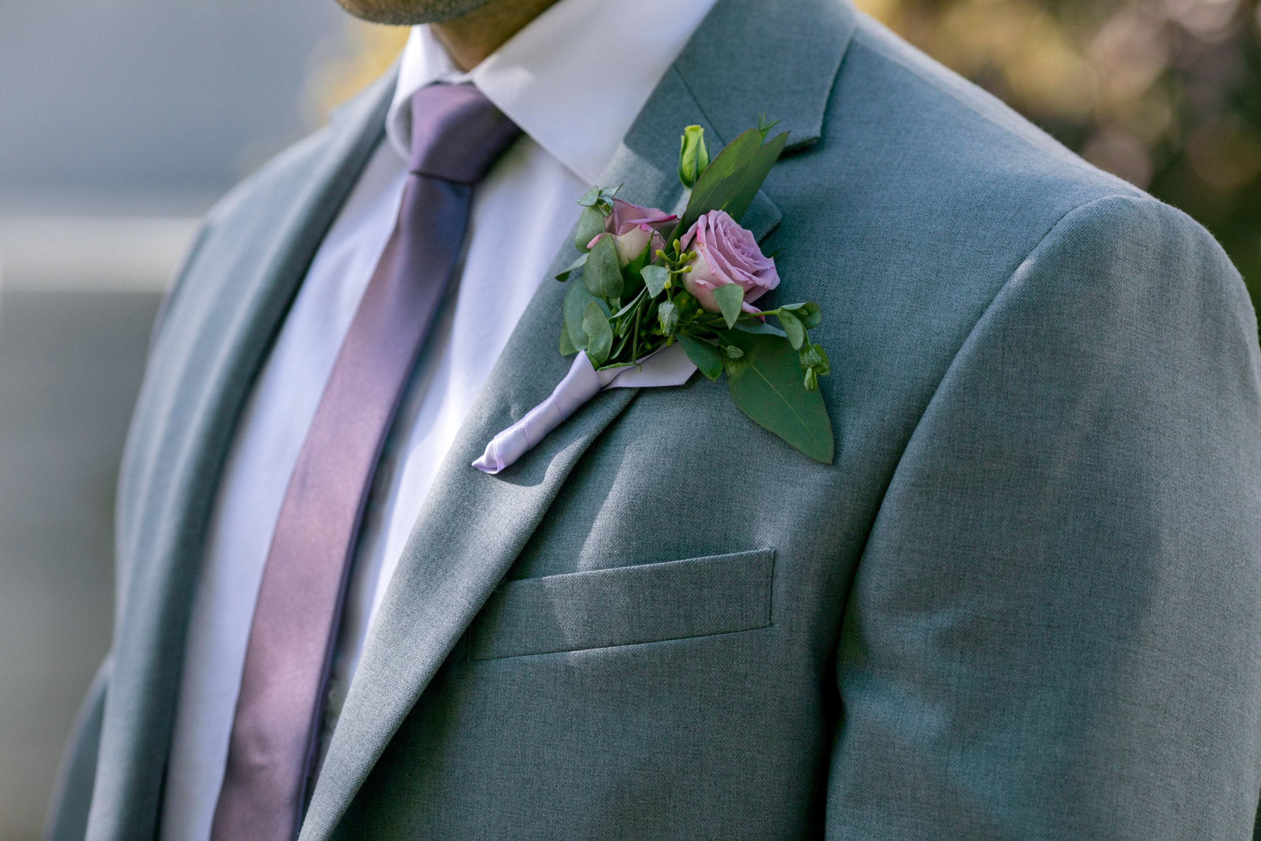 purple wedding flowers; purple boutonnierre