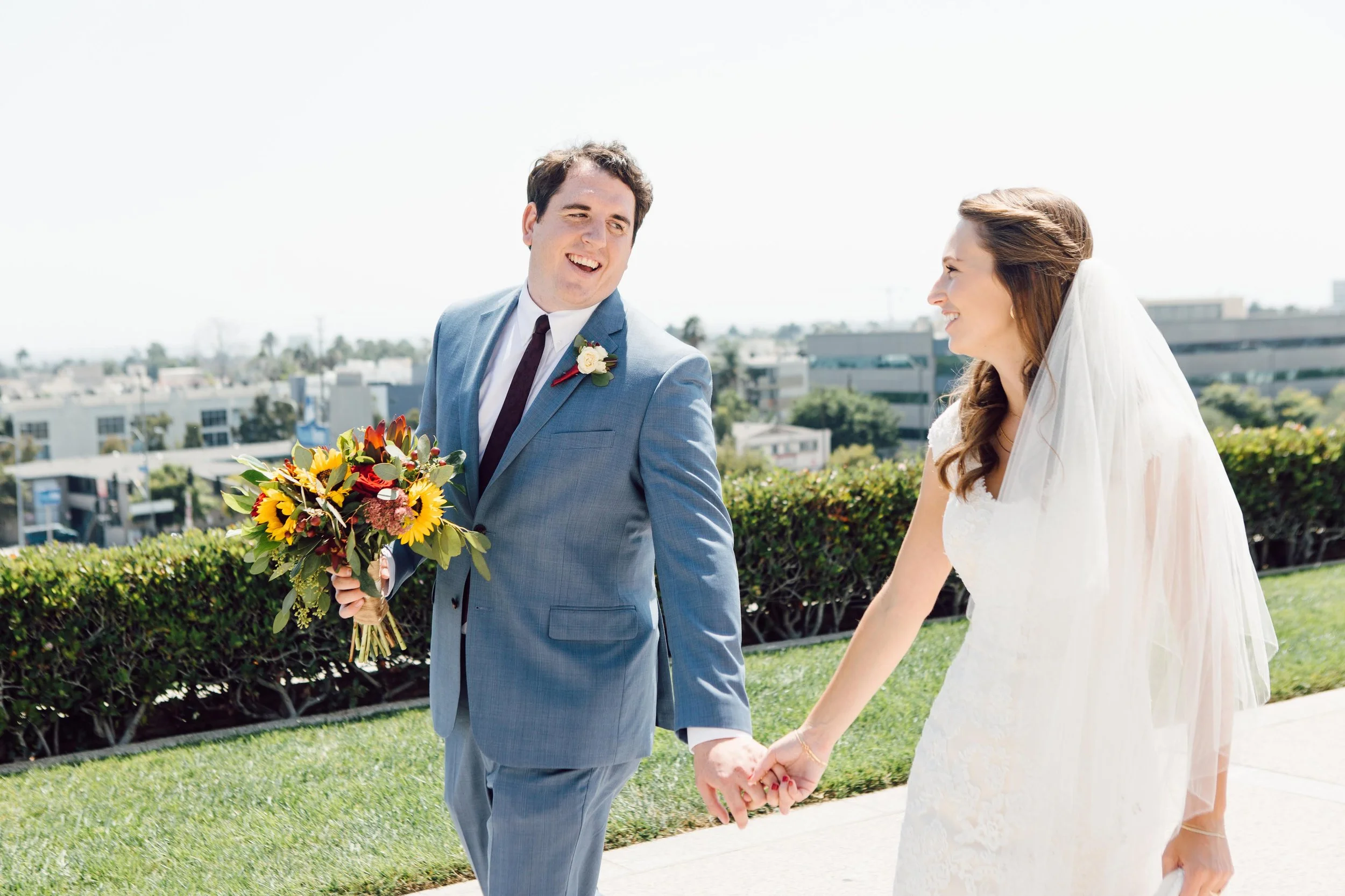 Laurie’s customers, Evan and Kade, running down a mountain after getting married. 