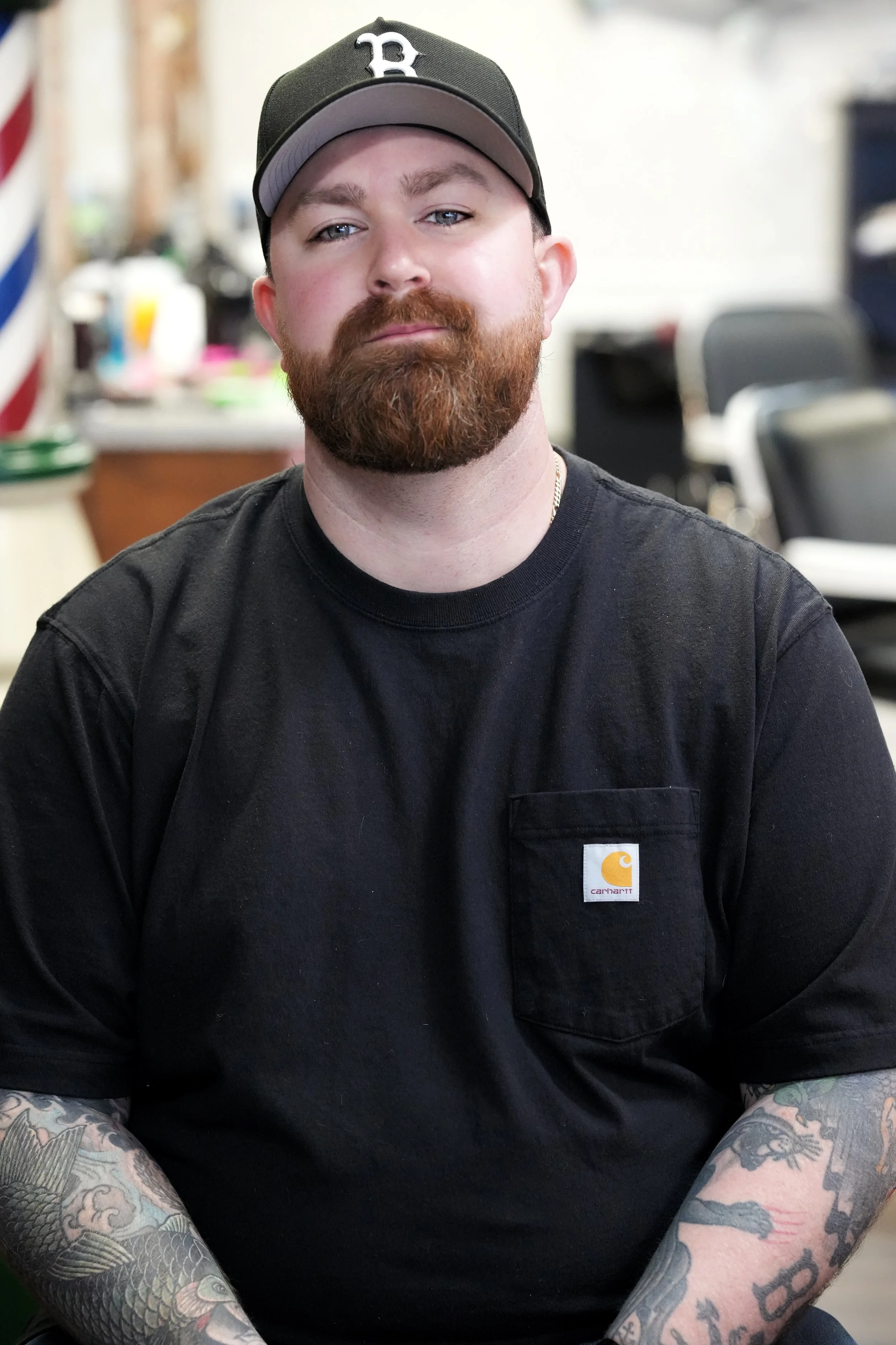 barber with beard and hat