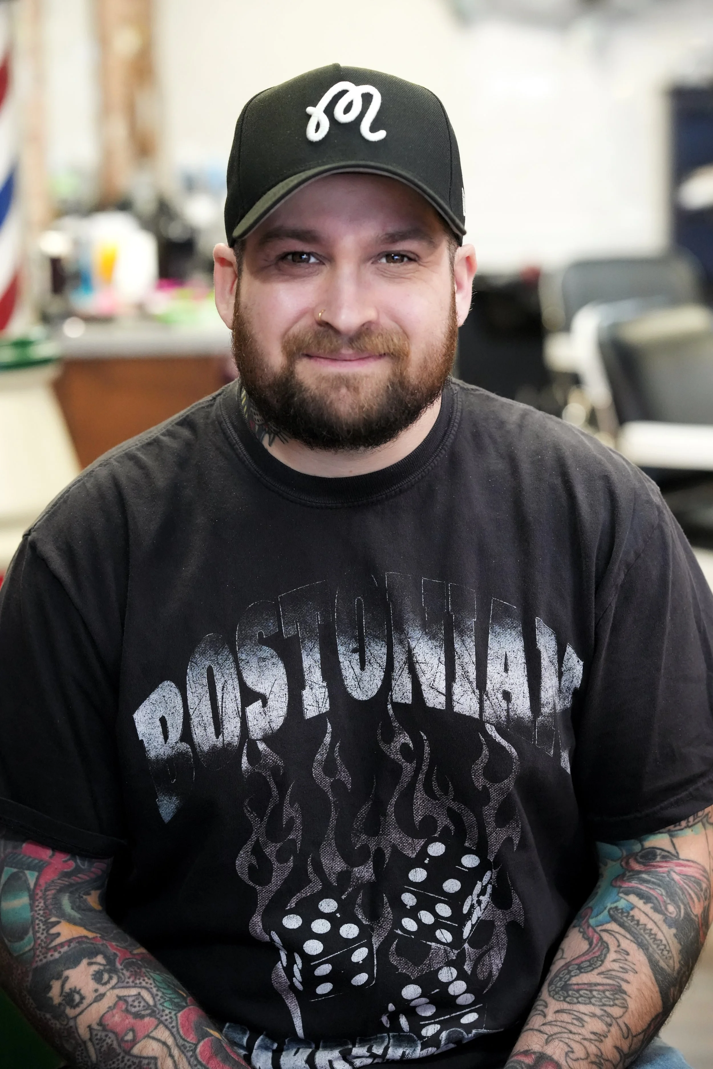whitman barber with beard and tattoos