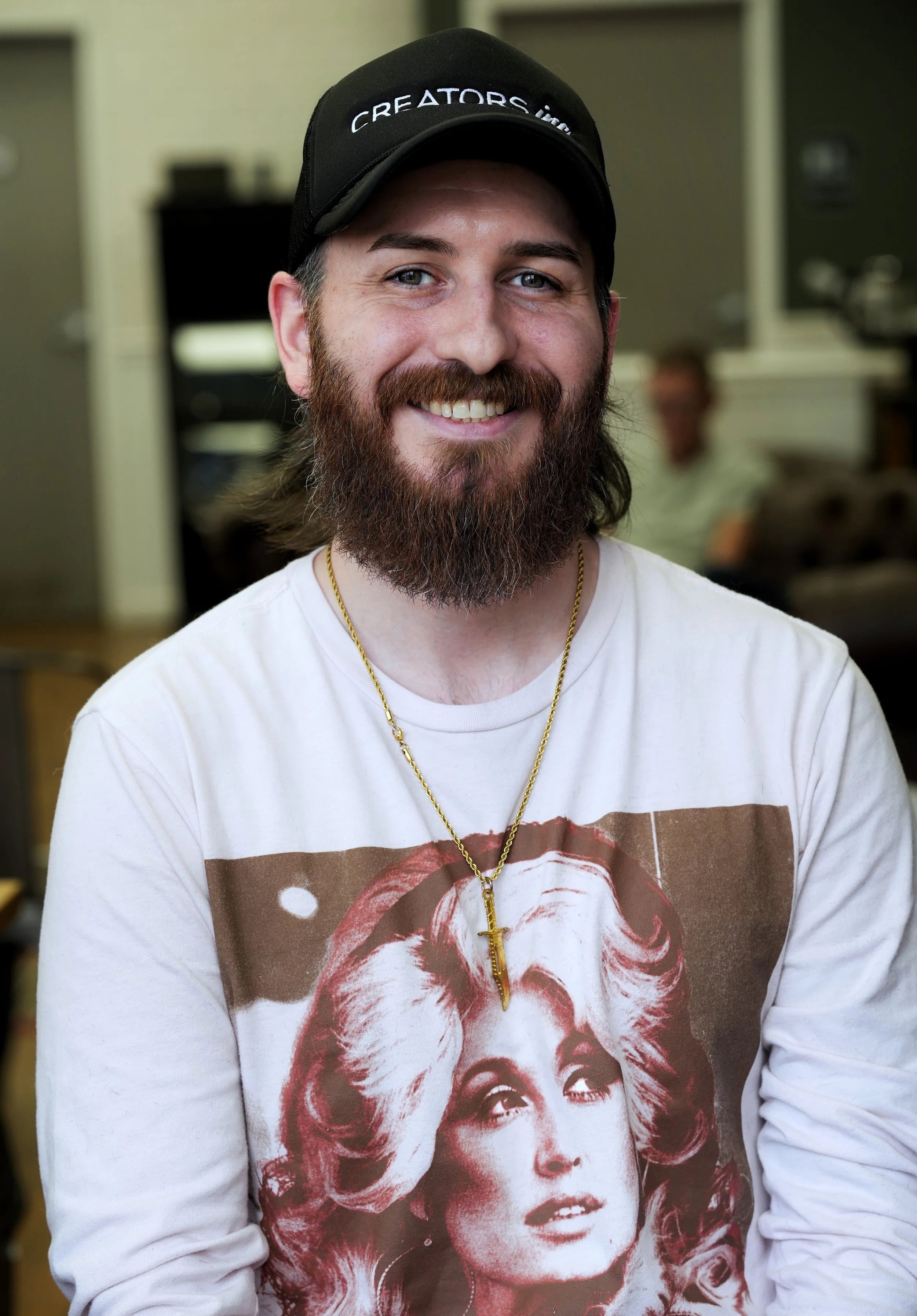 barber with beard and hat