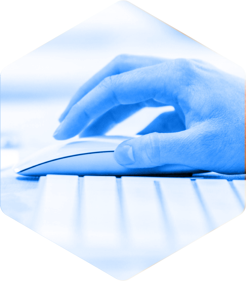 Close-up of a person's hand using a computer mouse on a keyboard.