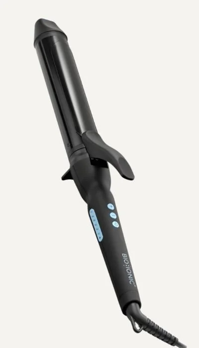 A black hair curling iron with digital temperature control buttons.