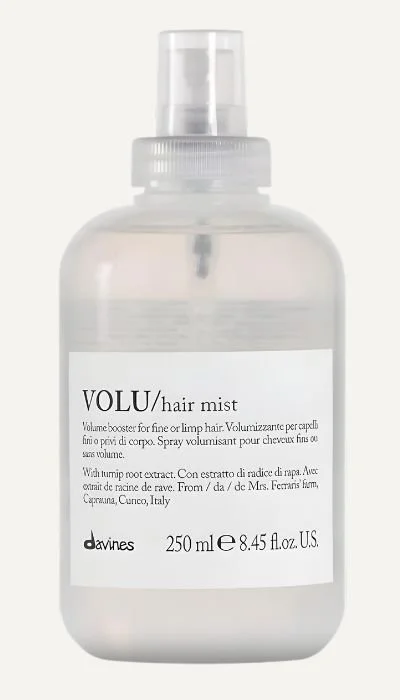 A clear plastic spray bottle of Volu hair mist with a white label and black text, containing 250 ml or approximately 8.45 fl oz of product.