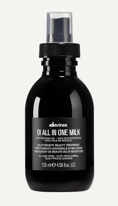 Black bottle of Davines OI All In One Milk with a pump dispenser, designed for hair care, 135 ml (4.56 fl. oz.).