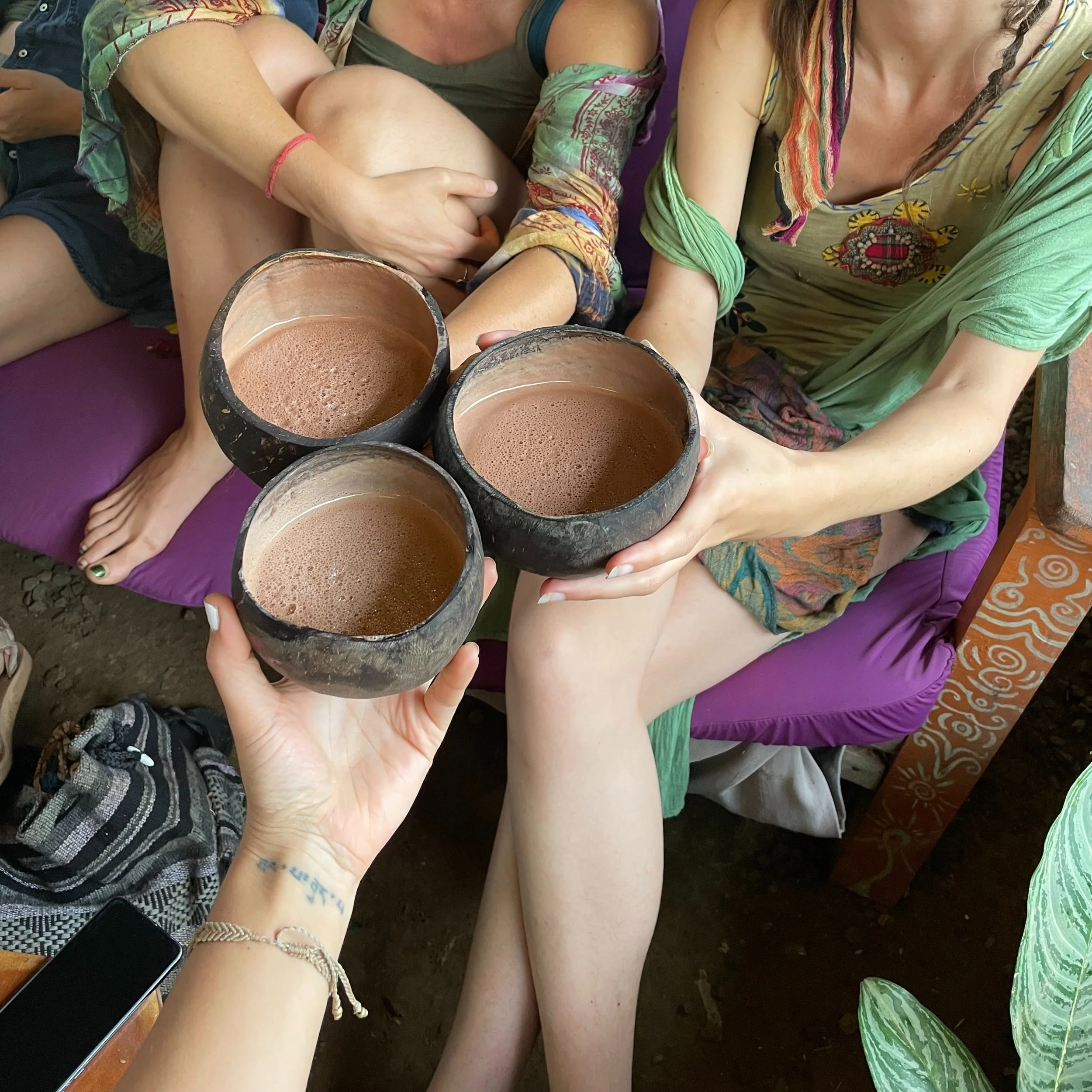 sisters holding cocao cups