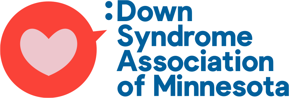 Logo of the Down Syndrome Association of Minnesota, featuring a large red speech bubble with a light pink heart inside, and blue text on the right.