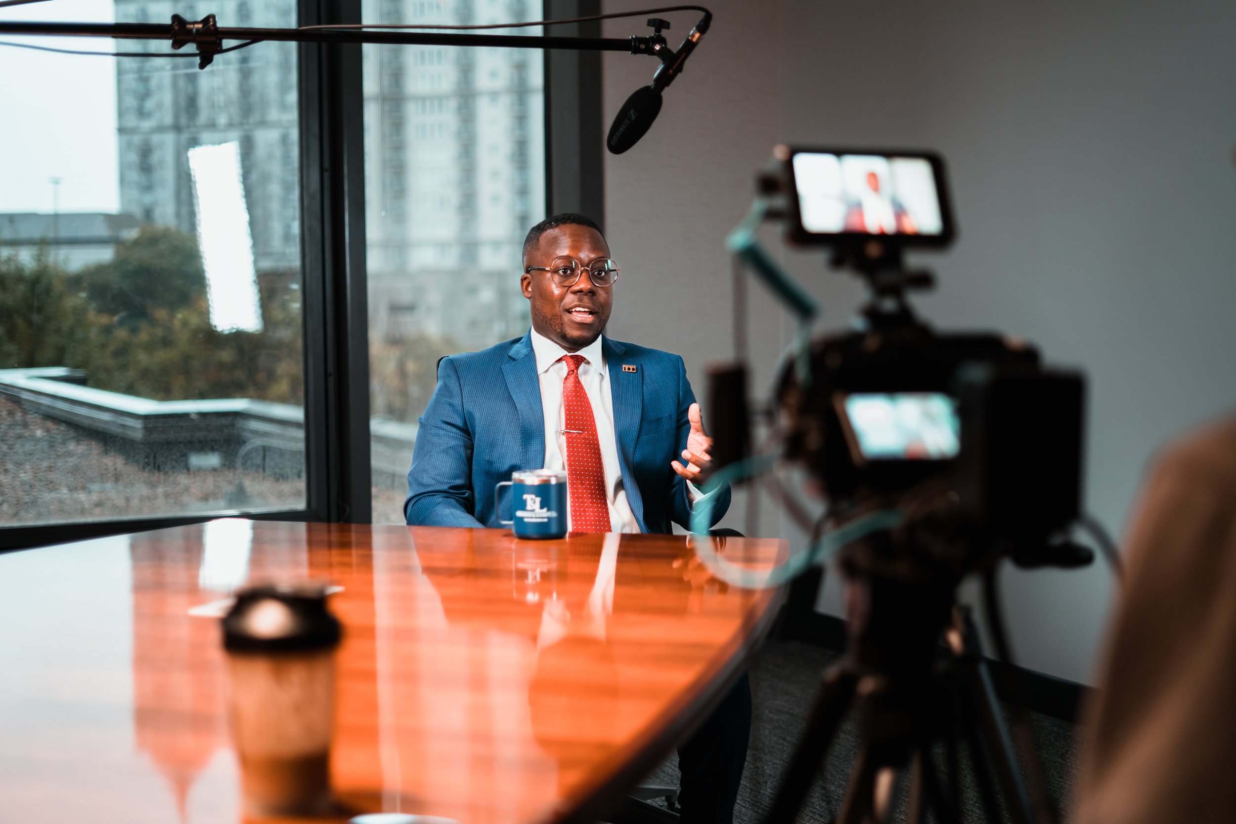 Diriki Geuka, director of Rogue Elephants, participates in an on-camera interview filmed at the offices of Townsend & Lockett, LLC.