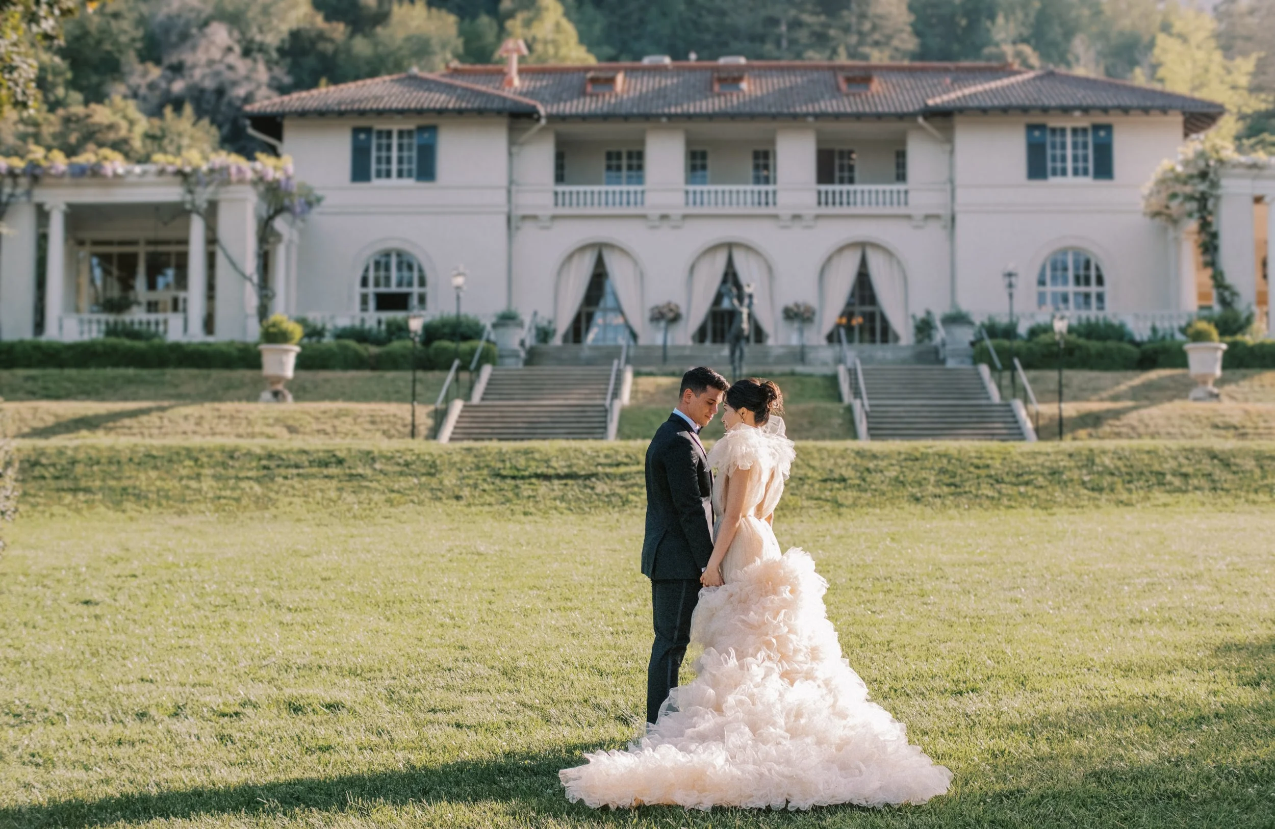 Bride and groom sharing a romantic portrait on the grounds of Montalvo Arts Center in Saratoga, California, during an elegant estate wedding.