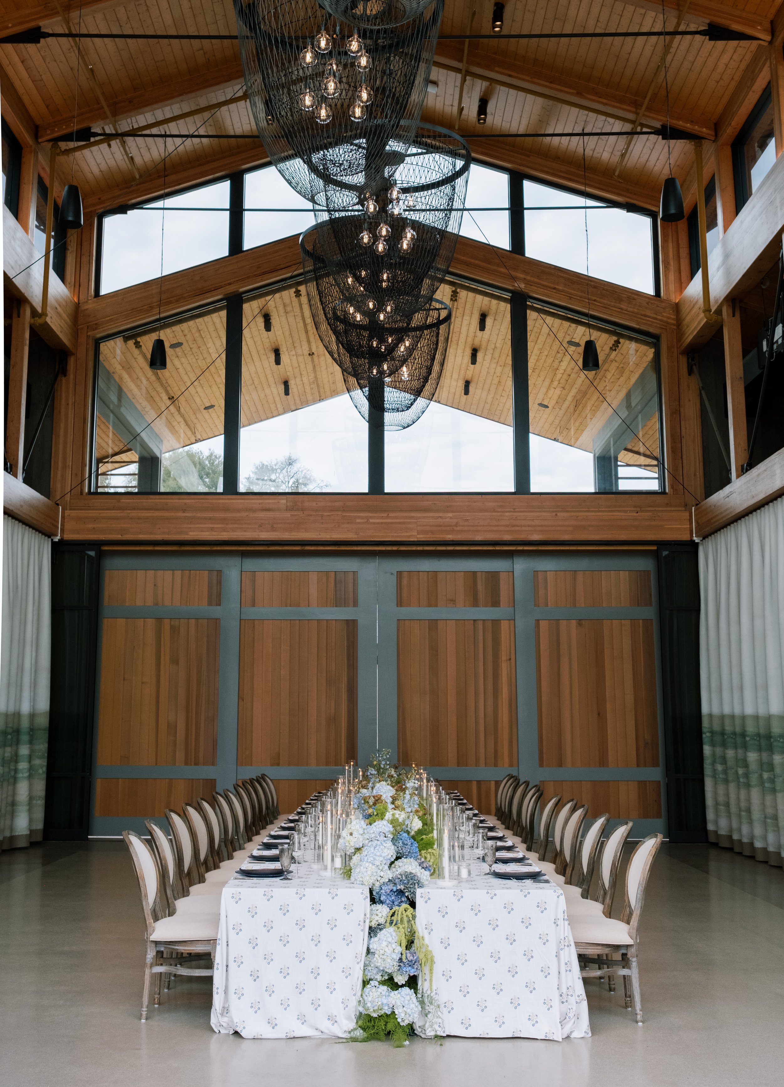 Elegant reception space at Appellation Healdsburg in Healdsburg, Sonoma County, California, featuring long reception tables, refined floral décor, and luxury Wine Country wedding design.
