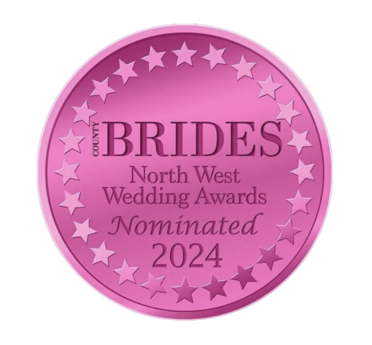 Pink circular badge with stars, reads 'North West Wedding Awards Nominated 2024' for bridal awards.