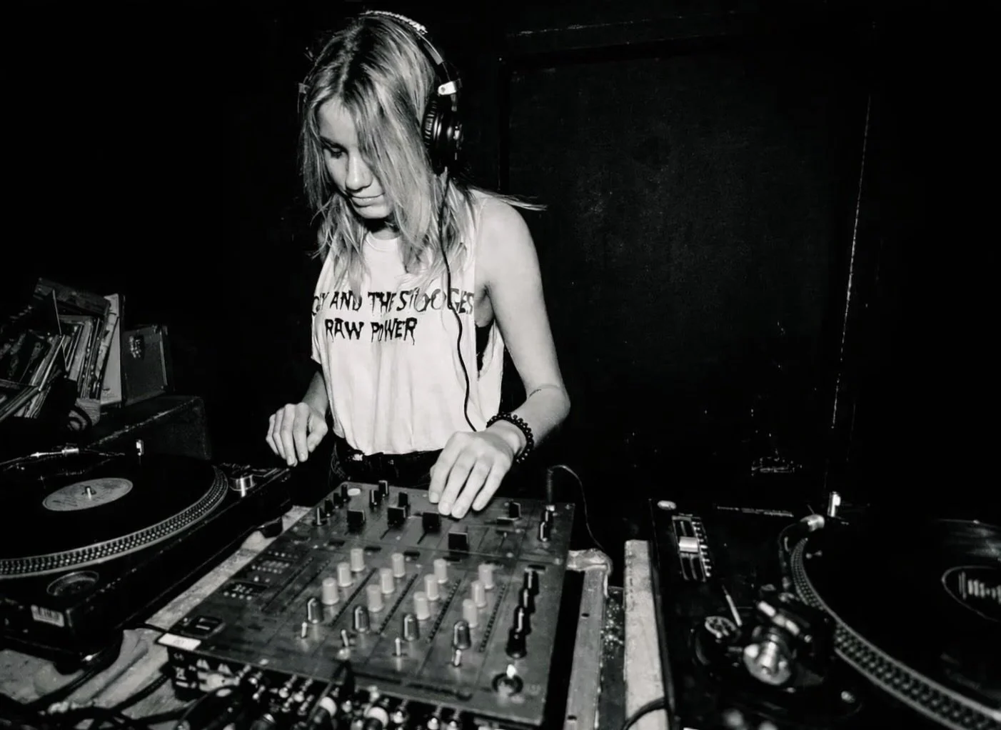 Nina Velvet  DJ spinning vinyl records in a Berlin Club. 
